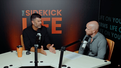 A photo of Ryan and Tyler looking at each other while speaking in 